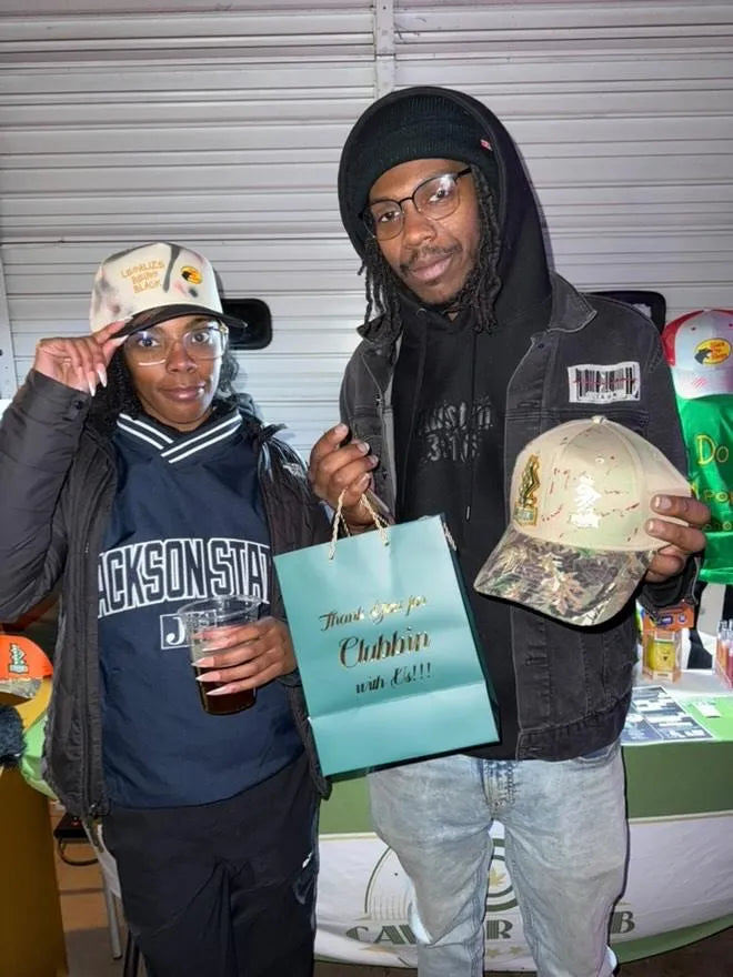 Members with a 'Thank you for clubbin' with us' bag at a Caviar Club event